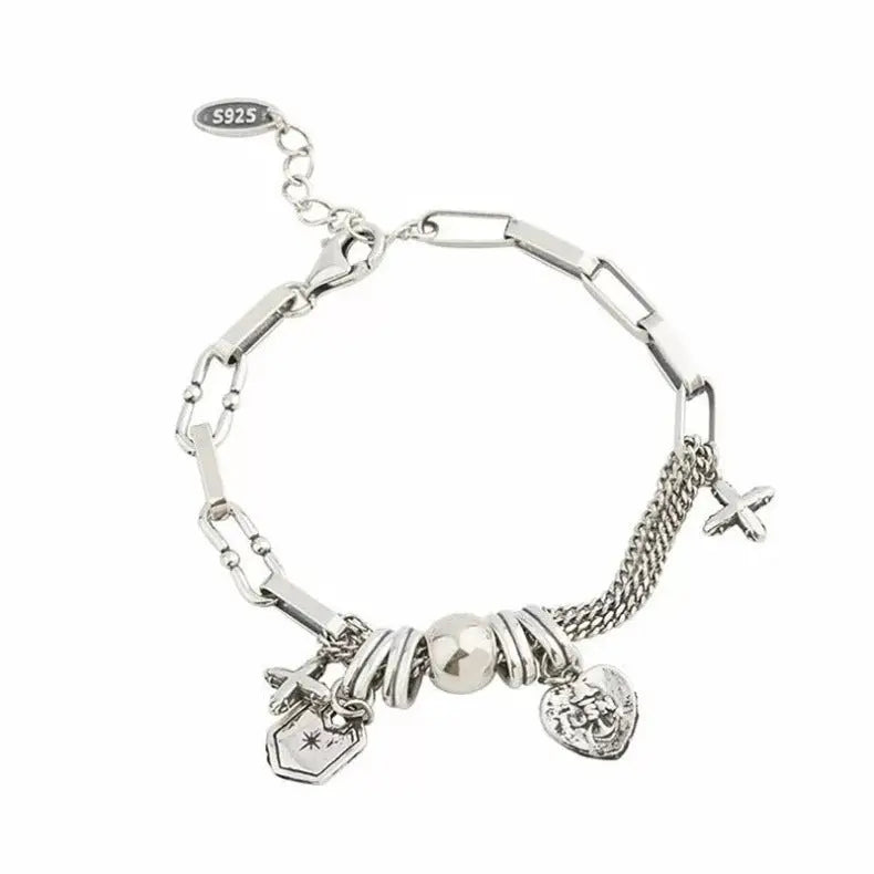CROSS CHARM LAYERED BRACELET Mira Gemini