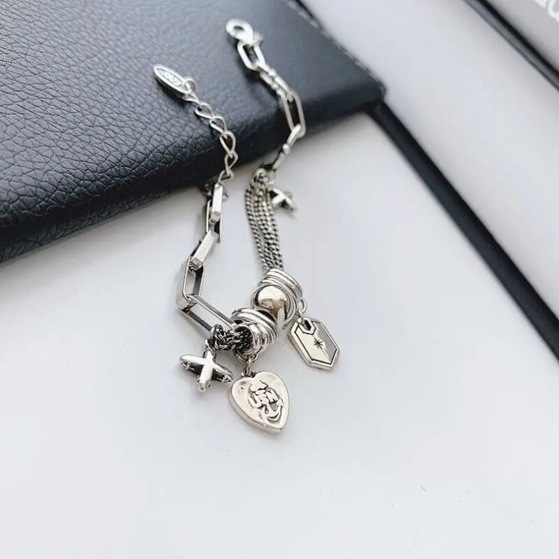 CROSS CHARM LAYERED BRACELET Mira Gemini