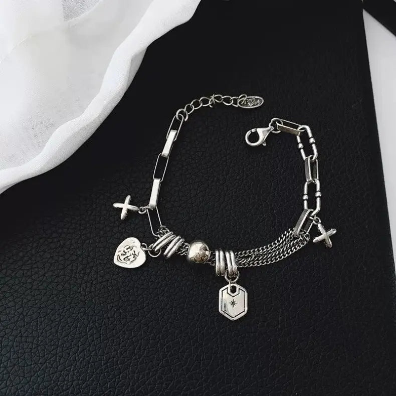 CROSS CHARM LAYERED BRACELET Mira Gemini