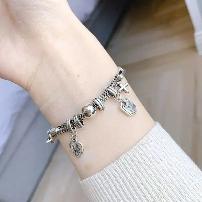 CROSS CHARM LAYERED BRACELET Mira Gemini